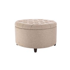 a round ottoman sitting on top of a white floor