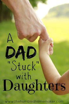 a father holding his child's hand with the words, a dad stuck with daughters