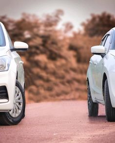 two cars parked side by side on the road