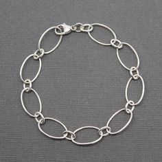 Hey, I found this really awesome Etsy listing at https://www.etsy.com/listing/483368672/oval-round-chain-bracelet-sterling Silver Bracelet Chain, Silver Smithing, Sterling Silver Jewelry Rings, Silver Link Bracelet, Black Beaded Bracelets, Silver Jewelry Design, Silver Chain Style, Bracelet Chain, Onyx Bracelet