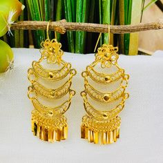 Beautiful and stunning handmade Mexican Filigree Earrings. Each piece is meticulously created out of copper wire and spun into a beautiful design. To give it the final touch artisans dipped into gold plate for it's gold color. This accessory is an important part of the traditional Tehuana outfit from Oaxaca, Mexico. Look elegant while wearing Mexico's culture with this one of a kind earrings! Approximate length: 3-3.5 in Need more than one? Ask us about our combined flat rate shipments for multi Bohemian Bridal Earrings With Intricate Design, Bohemian Pierced Linear Earrings As Gift, Ornate Ceremonial Drop Earrings, Ceremonial Drop Earrings, Bohemian Drop Bridal Earrings For Festivals, Intricate Dangle Hoop Earrings For Festivals, Ceremonial Dangle Earrings, Ceremonial Intricate Dangle Chandelier Earrings, Ceremonial Intricate Chandelier Drop Earrings