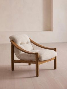 a white chair sitting on top of a hard wood floor