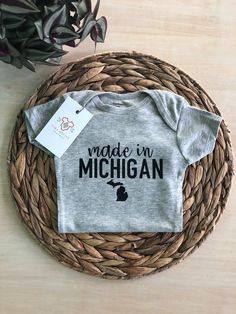 Made in Michigan bodysuit White or Gray  with black vinyl image. ✨Quality Vinyl Image ✨Ships in 1-2 Business Days Made In Michigan  | Michigan Bodysuit | Michigan Baby Gift | Michigan | Michigan Gifts | Baby Shower Gift | Michigan Shirt Michigan Gifts, New Buffalo, Bodysuit White, Gifts Baby, Black Vinyl, Gender Neutral Baby, Baby Shower Gift, Baby Gift, Baby Shower Gifts