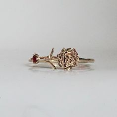 Our special collection of birth flower rings are inspired by the love of wearing something meaningful. Each birth flower is adorned with that month's birthstone. January's birth flower is Carnation and the birth stone is garnet. Materials: 14K solid gold 2mm natural garnet 1.1mm band thickness ** This item is specially made for you. Please allow 1-2 week lead time. Shipping:Domestic: Free standard shipping within the U.S.International: Free standard shipping for orders over $200 Customization:- Flower Shaped Promise Ring With Birthstone, Fine Jewelry Birthstone Flower Promise Ring, 14k Rose Gold Flower Ring With Birth Flower, Dainty Flower Ring With Birthstone For Anniversary, Dainty Birthstone Flower Ring For Anniversary, Delicate Flower Birthstone Promise Ring, 14k Gold Gemstone Flower Ring For Anniversary, May Birthstone Flower Ring As A Gift, Fine Jewelry Flower-shaped Birthstone Promise Ring