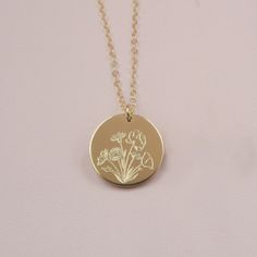 Our Wildflower necklace features a beautiful bouquet design engraved on the front, with the option to add a word, initials or a date on the back (or just keep it blank). Wildflowers are said to symbolize joy and the idea that life doesn't always have to grow according to plan to still be quite beautiful. Celebrate someone special in your life by gifting them this beautiful necklace and add a custom personalization on the back for the perfect touch. DETAILS: - 14kt gold filled or sterling silver Dainty Birth Flower Jewelry For Anniversary Gift, Birth Flower Jewelry For Anniversary Gift, Birth Flower Jewelry For Anniversary, Engraved Rose Gold Necklace With Flower Pendant, Flower-shaped Engraved Jewelry For Personalized Gifts, Etched Flower Pendant Necklace For Gift, Rose Gold Engraved Flower Pendant Necklace, Flower Pendant Jewelry For Anniversary Gift, Engraved Flower Jewelry For Personalized Gift