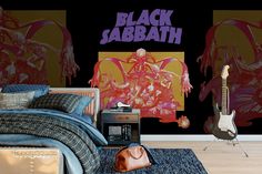 a bedroom scene with focus on the bed and guitar wallpapered in black, sababath