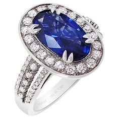 Our new platinum custom natural Ceylon sapphire ring features an oval-cut blue sapphire that measures 11.34 x 6.78 x 3.89 mm and weighs 2.37 carats. The sapphire has a GIA color grade of B 6/4, which means it has a medium-dark, moderately strong blue color with no secondary colors. It is also GIA-certified. The sapphire is set with 62 round brilliant cut diamonds weighing 0.62 carats, with VS-SI clarity and G-H color. The sapphire displays perfect tone and saturation, giving off a beautiful bright blue hue. Our master jeweler has set this stunning sapphire into a custom ring, surrounded by a halo of large brilliant-cut diamonds. Three rows of diamonds accent both sides of the ring shank, beautifully showcasing the natural sapphire. Be sure to check out the accompanying pictures to see this Bills Paid, Platinum Sapphire Ring, Ceylon Sapphire Ring, Secondary Colors, Ceylon Blue Sapphire, Contemporary Engagement Rings, Yellow Sapphire Rings, Perfect Blue, Ring Shank