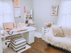 a white desk sitting next to a window in a room