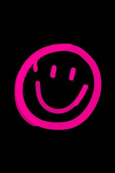 a pink smiley face on a black background