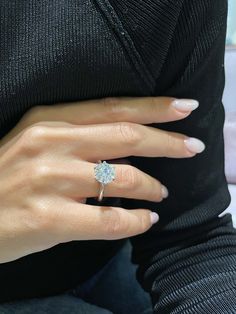 a woman's hand with a ring on it