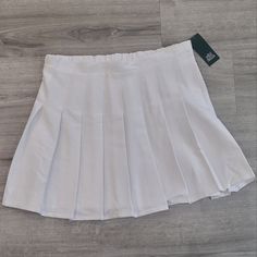 Womans White Pleaded Skirt . Size Large Nwt. Preppy Pleated Skirt In A Specific Color, Solid Color Pleated Preppy Skirt, Lined Skirt Skort For School, Lined Skort For School, Spring School Uniform Style Tennis Skirt In Solid Color, Preppy Solid Pleated Mini Skirt, Preppy Solid Pleated Skirt, High Waist Pleated Tennis Skirt In Preppy Style, Preppy High-waisted Pleated Skirt