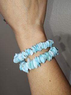 Beautiful & Natural Larimar Chip Bracelets. Great Quality Amazing blue color. Stretchable  Wrist Size: 6in & 6.25in **Please measure your wrist size & choose accordingly** ✨️The meaning of Larimar is clear communication and inner wisdom. Larimar combines the energy of the oceans with the energy of the heavens which means Larimar helps to combine our thoughts (air) with our emotions (water).  *DISCLAIMER: You will be getting item pictured. These are natural and genuine crystals and due to lighting effect and computer color, the actual color may vary depending on room lighting and sun light. We try our best to make listings as accurate as possible. Please make sure to check all pictures and videos.  *Gemstones are special and each one has their own unique vibration and properties. They requi Handmade Blue Larimar Jewelry, Handmade Adjustable Larimar Bracelets, Turquoise Larimar Natural Stone Bracelets, Turquoise Larimar Bracelets For Gifts, Turquoise Larimar Bracelets As A Gift, Adjustable Turquoise Larimar Beaded Bracelets, Blue Larimar Hypoallergenic Jewelry, Adjustable Blue Larimar Jewelry, Adjustable Light Blue Healing Bracelets