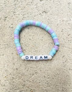 This bracelet is very cute. And will give you sweet dreams. Trendy Handmade Pastel Bracelets, Trendy Pastel Friendship Bracelets As Gift, Pastel Letter Beads Bracelet For Gift, Pastel Letter Beads Bracelet As Gift, Cute Pastel Bracelets For Friendship, Cute Pastel Bracelet For Friendship, Cute Bracelet Wristband With Letter Beads, Cute Wristband Bracelet With Letter Beads, Trendy Adjustable Pastel Bracelets