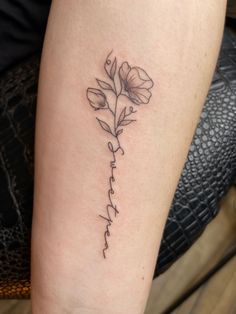 Forearm tattoo. Black ink. Dainty lines. Sweet Pea flowers where the stem spells “sweetpea.” Sweetpea Flower Tattoo, Tattoos About Healing, Resilience Tattoo, Name Flower Tattoo, Dainty Tattoo, Flower Spine Tattoos, Simple Tattoos For Women