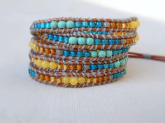 Wheat and Sky 5x wrap bracelet by TowerCreationsbyTC Brown Beaded Wrap Bracelet For Friendship, Yellow Bohemian Beaded Bracelets With Gemstones, Unique Beaded Brown Wrap Bracelet, Unique Brown Beaded Wrap Bracelet, Boho Jewelry Diy Bohemian, Hippie Jewelry Rings, Beaded Leather Wraps, Beadwork Bracelet, Jewelry Wardrobe