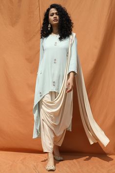 Mint green kurta paired with off white draped pants. Comes with attached dupatta.
Components:2
Printed details
Neckline:Round
Sleeve Length:3/4th sleeves
Fabric:Cotton Georgette
Color:Green,White
Asymmetric hemline - Aza Fashions High Low Kurta, Draped Pants, Dhoti Salwar, Stylish Drapes, Bohemian Culture, Drape Pants, Kurta Set For Women, Harem Pant, Mint Blue