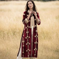 The claret silk velvet coat, with its stunning contrasting embroidery, combines elegance with style, standing out wherever you go from day to night effortlessly. Dry clean only  100% silk velvet Elegant Long Outerwear With Intricate Embroidery, Elegant Fall Kurta With Floral Embroidery, Elegant Floral Embroidered Kurta For Fall, Elegant Floral Embroidery Kurta For Fall, Elegant Long Kurta For Fall, Elegant Floral Embroidered Kurta For Winter, Elegant Fall Outerwear With Zari Work, Elegant Kurta With Zari Work For Fall, Elegant Outerwear With Dupatta For Eid