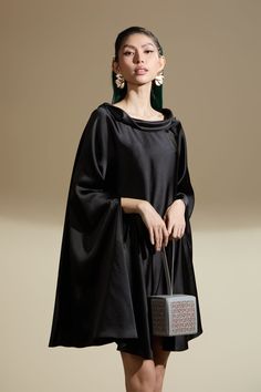 Expertly crafted with luxurious silk satin material, this dress offers both style and comfort. The distinctive flared batwing sleeves provide a unique and elegant look, making it a perfect choice for any occasion. Stay on trend and stand out with this timeless dress. * Product can be stylized both as dress & top. Silk Dress With Draped Sleeves, Silk Cape Dress For Parties, Silk Cape Dress For Formal Occasions, Formal Silk Cape Dress, Silk Cape Dress For Evening, Evening Silk Cape Dresses, Elegant Silk Crepe Dress For Evening, Elegant Silk Dress With Cape Sleeves, Elegant Silk Dresses With Cape Sleeves