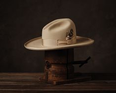 Now shipping. We are only making four dozens, so there is a good chance we will run out. If your size is not available, subscribe to our mailing list and we will let you know when the next run is released in May. A classic Western hat with some flourish. The pictures speak for themselves and here are the specs: buckskin color (light tan); 4 1/4" gentle Gus crown; 5 3/4" brim, bound, rolled edge; a 12-ligne bone grosgrain ribbon band; the highest quality hand-reeded leather sweatband; and our own Greeley Hat Works, Mens Dress Hats, Making Hats, Fedora Hat Men, Western Hat, Bowler Hat, Unique Hats, Western Hats, Dress Hats