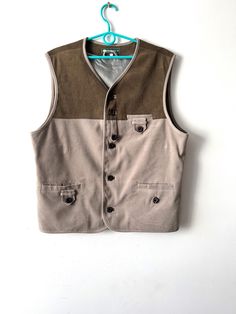 "Vintage Medium size mens vest Everyday fitted Waistcoat Comfortable Mens Vest Grandpa garden Vest Men's walking vest brown grey mens vest N.B. Real color might slightly differ from picture. Label size: M Measurements:  (lying flat): Length: 27\"/ 68.5 cm Pit to pit: 23\"/ 58.5 cm Waist: 22\"/ 56 cm Please check measurements to insure a proper fit. Remember to allow yourself some extra room for movement. You can compare these with something from your closet that fits you well. This vest will come to you freshly laundered and ready to wear. Please feel free contact me if you need additional measurements or have any questions Condition: great vintage Condition SHIPPING * I ship worldwide via Priority mail (Latvijas Pasts) from Latvia (EU). * I ship from Europe, so please allow 2 to 3 weeks f Mens Formal Vest, Formal Vest, Vests Mens, Mens Formal, Latvia, Mens Vest, Vest Outfits, Label Sizes, Medium Size