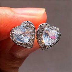 Our long-awaited arrival is here! You will look and feel beautiful when you wear your elegant heart-shaped earrings. Get them before they're gone! Vintage Wedding Jewelry, Stud Earrings For Men, White Studs, Sapphire Earrings Studs, Sapphire Studs, Halo Earrings Studs, Classic Earrings, Punk Jewelry, Stone Studs