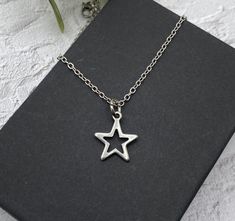 "This is a pretty minimalist star necklace - so pretty and great for layering. See all my stainless steel necklaces: https://www.etsy.com/shop/AlwaysPrettyThings?ref=seller-platform-mcnav§ion_id=21348272 Stainless steel is a darker metal than the bright sterling silver or silver plate. Stainless steel will not tarnish - you can wear it every day and it is perfect for sensitive skin.  ❤️ ADD ON UPGRADE SECTION for extras: https://www.etsy.com/shop/AlwaysPrettyThings?section_id=14811990&ref=shopse Minimalist Silver Star Necklaces, Stainless Steel Necklace With Star Charm For Gift, Stainless Steel Necklaces With Star Charm For Gifts, Star-shaped Stainless Steel Necklace For Gift, Stainless Steel Necklace With Star Charm As Gift, Stainless Steel Star Charm Necklace, Minimalist Silver Star Charm Necklace, Minimalist Necklace, Stainless Steel Necklace