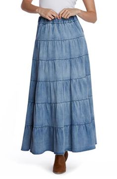 The season-staple denim maxi skirt is updated with a flouncy tiered ruffles and an easy elastic waistband. Elastic waist Unlined 62% lyocell, 20% cotton, 12% polyester, 5% rayon, 1% spandex Machine wash, tumble dry Imported Casual Tiered Maxi Skirt With Ruffles, Casual Tiered Ruffle Maxi Skirt, Casual Tiered Denim Skirt, Spring Denim Tiered Ruffled Skirt, Flowy Denim Tiered Skirt, Spring Ruffled Tiered Denim Skirt, Spring Tiered Ruffled Denim Skirt, Spring Medium Wash Tiered Skirt, Cotton Tiered Denim Skirt With Ruffles