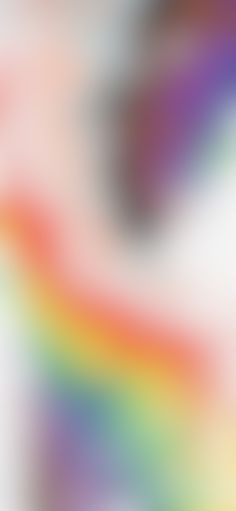 an abstract blurry background with rainbow colors