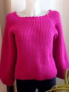 Crochet sweater is a perfect fuchsia pink colour off the shoulder top, with long sleeves. Look great with jeans trousers or skirt brighten up your autumn and winter months.  This sweater ready to ship in a Size:  Medium 12-14 UK            Medium  40-42 EU            Medium    8-10 US  Material:  100% Acrylic Care Instructions:  Machine Wash 40oC Hand Wash 40oC Pink Knitted Long Sleeve Top, Pink Long Sleeve Knitted Top, Pink Knitted Crochet Top, Pink Crochet Tops For Fall, Pink Stretch Knit Sweater, Stretch Pink Knit Sweater, Pink Crochet Knit Tops, Winter Crochet Stretch Sweater, Crochet Stretch Sweater For Winter