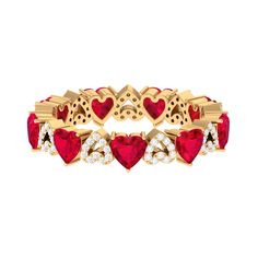 a gold ring with red hearts and diamonds on the inside, set against a white background