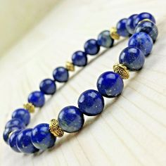 Genuine gemstone bracelet Lapis Lazuli 8mm Golden Tibetan Pearls Delivered in its organza pouch Elegant Bracelets With 8mm Beads As A Gift, Elegant 8mm Beads Bracelet For Meditation, Elegant Crystal Bracelet For Meditation, Elegant Gold Crystal Bracelet For Meditation, Elegant Hand-strung Crystal Bracelet For Meditation, Elegant Stretch Bracelet With 8mm Beads For Meditation, Elegant 8mm Beads Stretch Bracelet For Meditation, Elegant Hand-strung Crystal Bracelet For Healing, Elegant Hand-strung Stretch Bracelet For Meditation