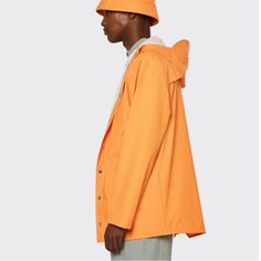 New With Tags! Rains Hooded Button Down (Snap) Rain Jacket. Armpit Vent Holes. Button Snaps At End Of Arms Too. Size Xl. Unisex. Msrp $110. Color: Orange. Approx Measurements (Laying Flat, Not Stretched): Armpit To Armpit: 25” Armpit To End Of Sleeve: 21” Front Length (Fully Zipped/Top Of Zipper To Bottom Hem): 32” Back Length (Below Hood To Bottom Hem): 33” Very Sharp Raincoat And Excellent Quality! Urban Outerwear With Button Closure In Solid Color, Urban Outerwear With Button Closure, Button-up Outerwear With Snap Buttons For Streetwear, Streetwear Button-up Outerwear With Snap Buttons, Casual Long Sleeve Raincoat For Work, Casual Long Sleeve Workwear Raincoat, Casual Long-sleeve Workwear Raincoat, Casual Workwear Raincoat, Classic Long Sleeve Orange Outerwear