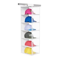 a white hat rack with six hats on it