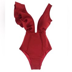 The Stunning Cosmopolitan Swimsuit In Red Features A One-Sided Ruffle Shoulder And Comes With A Multi-Colored Gem Belt Embellishment. High-Quality Double-Lined Polyester And Spandex Fabric That Allows For Quick Drying And Breathability. Padding Inserts Are Built In For Extra Volume And Support. - Polyester And Spandex Fabric - Breathable And Quick Dry - High Elasticity - Double Lined - Built-In Padding - Full Coverage Solid Sleeveless Party One-pieces, Solid Sleeveless One-piece For Party, Sleeveless Party One Piece With Lined Body, Sleeveless Lined Body One Piece For Party, Sleeveless One Piece With Lined Body For Party, Sleeveless One Pieces For Beach Season Parties, Solid Color One Pieces For Beach Season Party, Solid Color One Piece For Beach Season Party, Solid One Piece For Beach Season Party