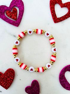 Super cute bracelet to wear as you celebrate Valentine's Day! Bracelet can be personalized upon request.  💟Choose your size and at checkout.  💟Please indicate the desired sizing within the customization section. Sizing length is as follows:  Women's small: 6.5 inches Women's medium: 7 inches Women's large: 7.5 inches Women's XL: 8 inches Children's 4-5 years old: 5.75 inches Children's 6-7 years old: 6 inches Children's 8-9 years old: 6.25 inches Children's 10-13 years old: 6-7 inches 💟Listin Personalized Gold Beaded Bracelet For Valentine's Day, Cute Heart Bracelet With Round Beads For Valentine's Day, Gold Beaded Bracelet For Valentine's Day Personalized Gift, Personalized Charm Bracelet With Round Beads For Valentine's Day, Personalized Charm Bracelet For Valentine's Day, Personalized Letter Beads Jewelry For Valentine's Day, Cute Stretch Bracelet With Letter Beads For Valentine's Day, Customizable Pink Bracelets For Valentine's Day, Cute Letter Beads Stretch Bracelet For Valentine's Day