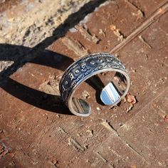 "This is a new style adjustable sterling silver ring features Buddhist Prayer \"Om Mani Padme Hum\" in Tibetan characters on the outside. The embossed Powerful Six Symbols in Tibetan Buddhism are: 唵（om）、嘛（ma）、呢（ni）、叭（pad）、咪（me）、吽（hum）. This simply elegant Buddhist Prayers Ring reminds us the key philosophy of Buddhism - All is Void. Humans often get loss in life while putting too much effort on judging others or complaining the surroundings, without realizing the world is just the reflection of Adjustable Silver Toe Rings, Adjustable Nickel Free Sterling Silver Engraved Ring, Adjustable Sterling Silver Engraved Ring, Nickel Free, Adjustable Silver Toe Rings As Gift, Silver Symbolic Toe Rings, Adjustable Nickel-free Sterling Silver Engraved Ring, Silver Engraved Open Ring As Gift, Silver Engraved Open Ring For Gift, Silver Open Ring Engraved For Gift