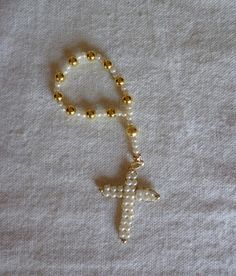 a beaded rosary with a cross on it