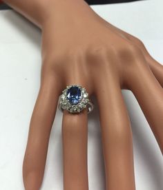 4.75 Carats Natural Very Nice Looking Tanzanite and Diamond 14K Solid White Gold Ring Suggested Replacement Value: $8,000.00 Total Natural Oval Cut Tanzanite Weight is: 3.50 Carats Tanzanite Measures: 9.00 x 7.00mm Natural Round Diamonds Weight: 1.25 Carats (color G-H / Clarity SI1-SI2) Ring total weight: 5.8g Disclaimer: all weights, measurements and colors are approximate and may vary slightly from the listed dimensions or as seen in the image. All pictures are magnified to show the smallest o Formal Oval Diamond Gemstones, Oval Diamond Gemstones For Formal Occasions, Elegant Pear-shaped Gemstones For Formal Occasions, Oval Center Stone Gemstones For Formal Occasions, Formal Platinum Gemstones Fine Jewelry, Elegant Pear-shaped Gemstones For Anniversary, Fine Jewelry Platinum Gemstones For Formal Occasions, Dazzling Sapphire Ring With Halo Setting For Formal Occasions, Elegant Formal Gemstones With Center Stone