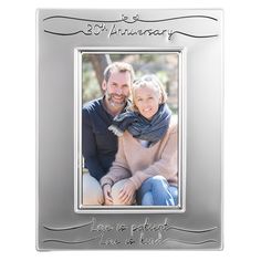 an anniversary photo frame with the words love is perfect in silver lettering on it and a couple