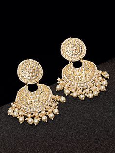 These exquisite gold-toned 2-layer crescent-shaped chandbali earrings come with kundan stone studs & beads, are gold-plated, and are secured with a post and back closure. These handcrafted chandbalis can be styled with any ethnic outfit for a dramatic impact, or an evening outfit to complete a dazzling look. Eitherway, complements are all yours! Product color may vary based on the monitor or screen you are using.See FAQ for more details. Size Length: 11 cm Details Material: BrassStones: Kundan & Luxury Bridal Chandbali Earrings With Tilla, Luxury Chandbali Earrings With Cutdana, Luxury Chandbali Cutdana Earrings, Heavy Gold Chandbalis For Festive Occasions, Bollywood Gold Chandbalis With Latkans, Bollywood Style Gold Chandbalis With Latkans, Festive Gold Chandbalis With Latkans, Heavy Gold Chandbalis For Festivals, Festive Gold Bollywood Chandbalis