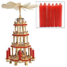 a wooden christmas tree with red candles