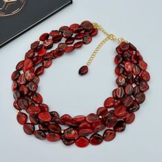 "This beautiful Dark Red Statement Necklace is completely handmade with high quality. Matching earrings are BONUS! This gorgeous necklace goes with everything and everywhere, holiday party or after work with friends! Made from acrylic clouds effect beads 16.5 x 13 x 6 mm and accented with gold plated bead spacers. Necklace length is 17\" long plus 3 inch extender chain for adjustment, and has light weight. The Necklace would be a PERFECT GIFT for you or for your family and friends! Necklace made Red Beaded Necklace For Party, Elegant Red Choker As Gift, Elegant Red Choker For Gift, Red Round Bead Necklaces For Party, Red Round Beads Jewelry For Evening, Red Round Bead Evening Jewelry, Red Round Beads Evening Jewelry, Red Choker Necklaces For Formal Occasions, Red Bib Necklace As Gift