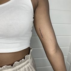 a woman with a small tattoo on her arm