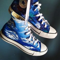 Custom hand painted Day & Night shoes. One shoe - blue summer sky with clouds. One shoe - blue galaxy design - night sky. Acrylic paint on canvas shoes. Every size is possible. I use US size chart! Shoes are hand painted using High grade acrylic paint. I use a special textile paint designed to be flexible on fabric. The paint is water proof and fade proof.  Prices depends on what model of shoes you will choose.  Let me know the style and your shoe size upon ordering as well as what you want pain Style Taylor Swift, Sky Shoes, Night Shoes, Galaxy Converse, Galaxy Shoes, Painted Shoes Diy, Cute Converse, Blue Galaxy, All Star Shoes