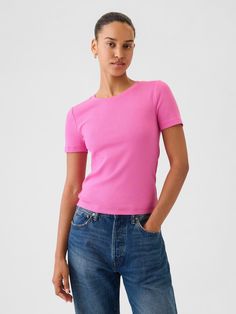 Supersoft modal-blend, slightly cropped T-shirt.  Crewneck.  Short sleeves.  * Fit: Stretch-to-Fit.  Slim & stretchy that forms to your shape.  Slightly cropped, hits at the waist.  Models wearing Gap Trendy Gap Short Sleeve T-shirt, Fitted Cropped Top By Gap, Gap Seamless Summer Tops, Gap Cropped Tops For Spring, Fitted Casual Crop Top By Gap, Fitted Gap Crop Top For Summer, Gap Stretch Seamless Tops, Fitted Gap Crop Top For Spring, Fitted Gap T-shirt For Summer