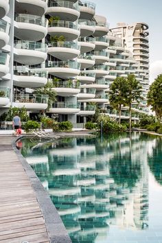 an apartment building next to a swimming pool