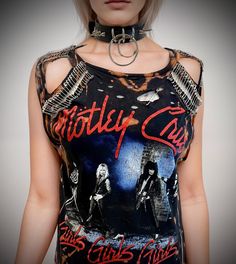 THE STITCHES Distressed Rock collection - This Mötley Crüe T-shirt is a handmade bleached crop top/t-shirt made with a brand new officially licensed band shirt. - Distressed Mötley Crüe  crop top/shirt - Safety pin unisex hand-made crop/tee - Material: Bleached cotton Measurements: Small size (Ready to ship) M, L, XL, XXL Sizes (Made to order: 10 working days process for made to order) Width (armpit to armpit)  S : 18 Inches  M: 20 Inches L: 22 Inches aXL: 24 Inches XXL: 26 Inches 3XL: 28 Inches For made-to-order tee: Due to all of the t-shirts being handmade, please understand that the bleach on each item is uniquely placed. - Length (top of collar to bottom) S: 25 inches For made-to-order, you can provide me with the length you prefer Care instructions: - This is a distressed item and wi Distressed Punk T-shirt, Edgy Acid Wash T-shirt For Alternative Fashion, Black Distressed Rocker Tops, Edgy Distressed Tops For Concert, Distressed Acid Wash T-shirt For Alternative Fashion, Distressed Rock T-shirt For Concerts, Distressed Band Merch Tops For Concert, Band Merch Distressed Top For Concert, Rocker Distressed Crew Neck Top