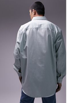 An oversized fit refreshes the classic style of a smart-casual button-up shirt made from pinstriped cotton poplin. 30" length, 42" chest (size medium) Front button closure Spread collar Long sleeves with two-button cuffs 100% cotton Machine wash, line dry Imported Chest Size, Smart Casual, Cotton Poplin, Light Green, Button Up Shirts, Classic Style, Button Up, Nordstrom, Size Medium