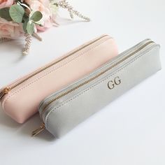 This cute Mini Accessory Case would make a lovely gift for a loved one, or even yourself!  It's perfect for keeping all your little bits safe in your bag. You could even use it as a pencil case or mini make up bag.  PERSONALISATION Each item can be personalised with either a name/role or the persons initials (in either gold, rose gold, silver, white or black). We also have 6 designs to choose from, as shown in the product photo's.  We will use gold text unless otherwise specified in the personalisation box. Please do get in touch if you have any questions and we will be happy to help. SPECIFICATION & FEATURES Available in Black, Black/Black, Grey or Pink (as shown in the photos, this is more of a peachy pink than baby pink) Dimensions: 22 x 5.5 x 4.5 cm 100% PU Leather Saffiano fine grain Portable Pencil Case For Gift, Portable Pencil Case As Gift, Portable Pencil Shaped Pencil Case For Gift, Portable Pencil-shaped Pencil Case Gift, Cute Portable Pencil Case For Gift, Cute Stationery Pen Holders As Gift, Cute Stationery Gift With Pen Holders, Cute Stationery Pen Holders For Gifts, Portable Pouch Pencil Case As Gift