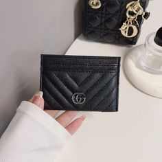 Introducing the epitome of sophistication and style: the Classic GG Wallet Card Holder - Luxury Edition. Crafted with meticulous attention to detail and unparalleled craftsmanship, this accessory seamlessly merges timeless elegance with modern functionality. Made from the finest quality materials, the Classic GG Wallet exudes luxury at every touch. Its iconic GG monogram pattern embossed on premium leather not only showcases impeccable taste but also speaks volumes about your discerning eye for Double G Logo, Leather Card Holder Wallet, Chic Quilts, Gg Monogram, G Logo, Monogram Pattern, Logo Set, Wallet Card, Everyday Accessories